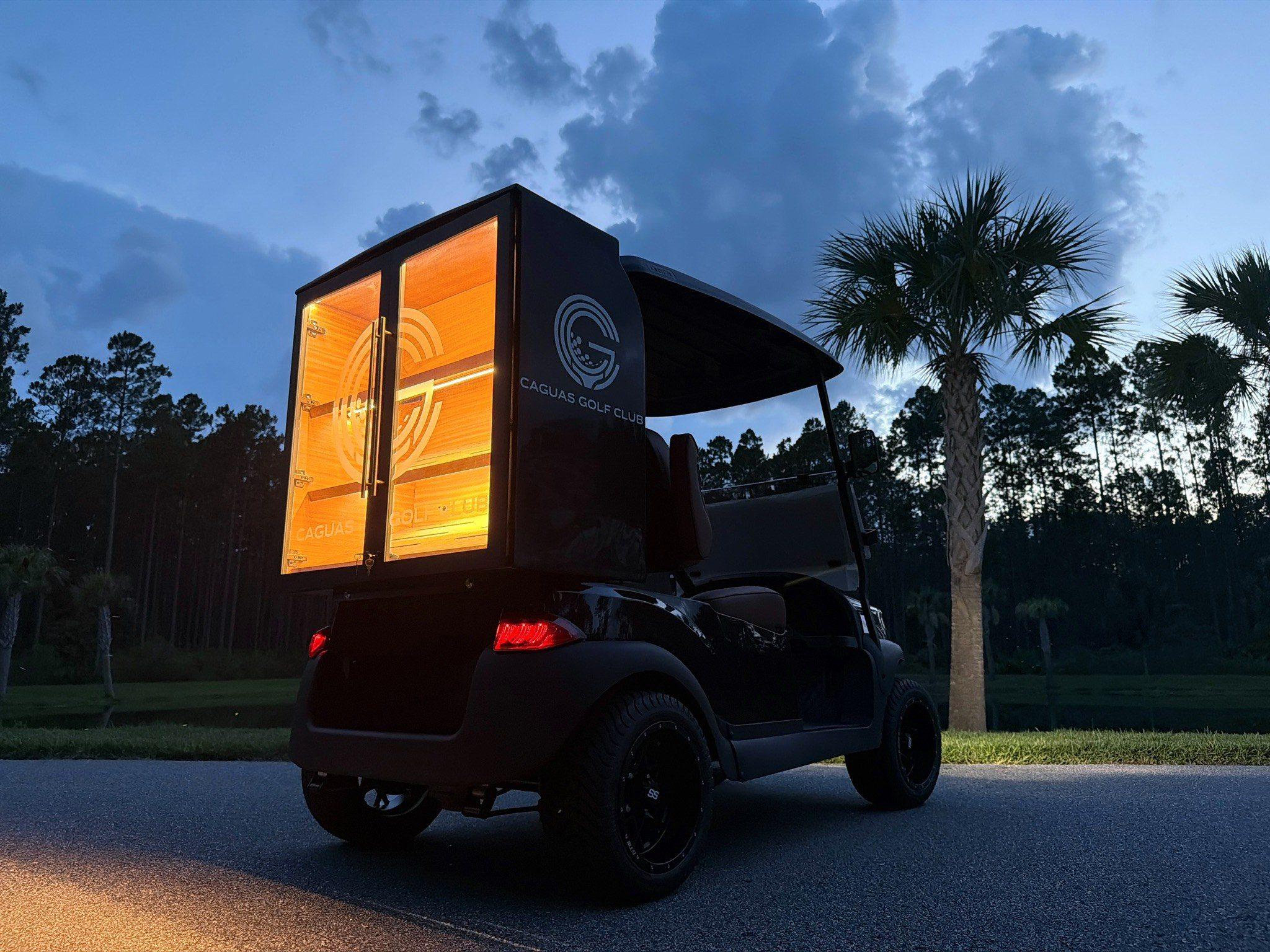 Caguas Golf Club cart at dusk, humidor illuminated